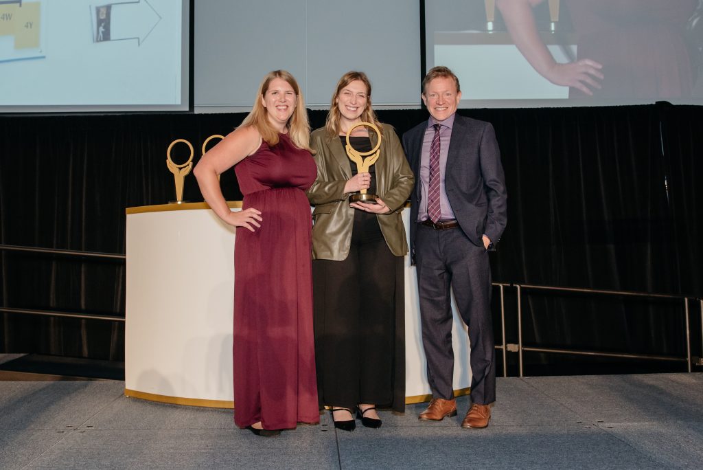 Image of Matthew Anderson presenting the Improved Care Team Well-being Award at the Ontario Health System Quality and Innovation Awards Ceremony to the SHINE Wellness Program Team